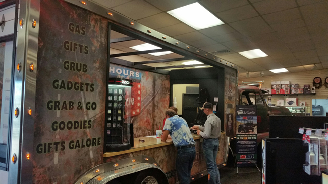 Oasis Travel Center Customers at Truck-Shaped Fuel DeskJI.jpg