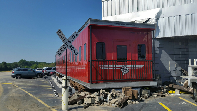 Oasis Travel Center-Red Train Crashing N2 BldgJI.jpg