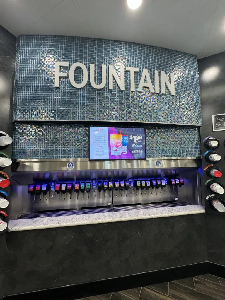Illuminated fountain drink station featuring four sizes and charitable cups - NATSO