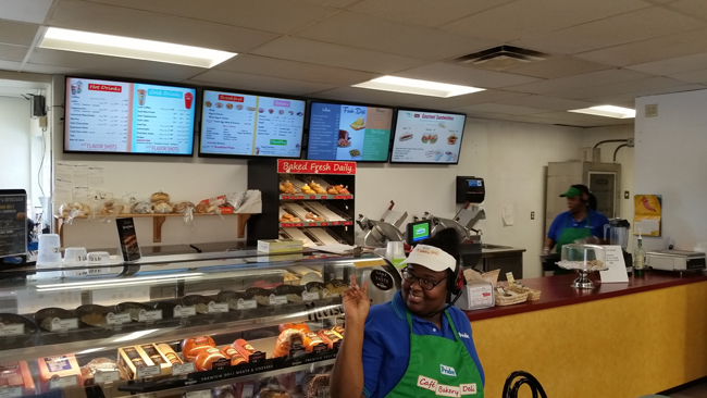 Pride Travel Center-Employee ThrowingPieceSign-Bakery-DeliJI.jpg