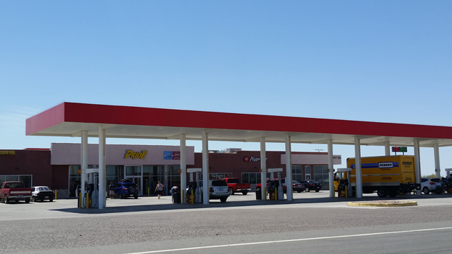 Pride Travel Center-Salome-FemaleCustomerWalking-CarsParked-FuelingJI.jpg