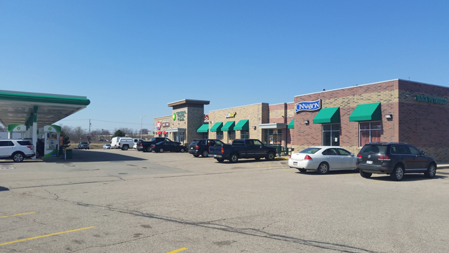 KenoshaTravelPlaza Bldg-Cars in Lot-FuelingJI.jpg